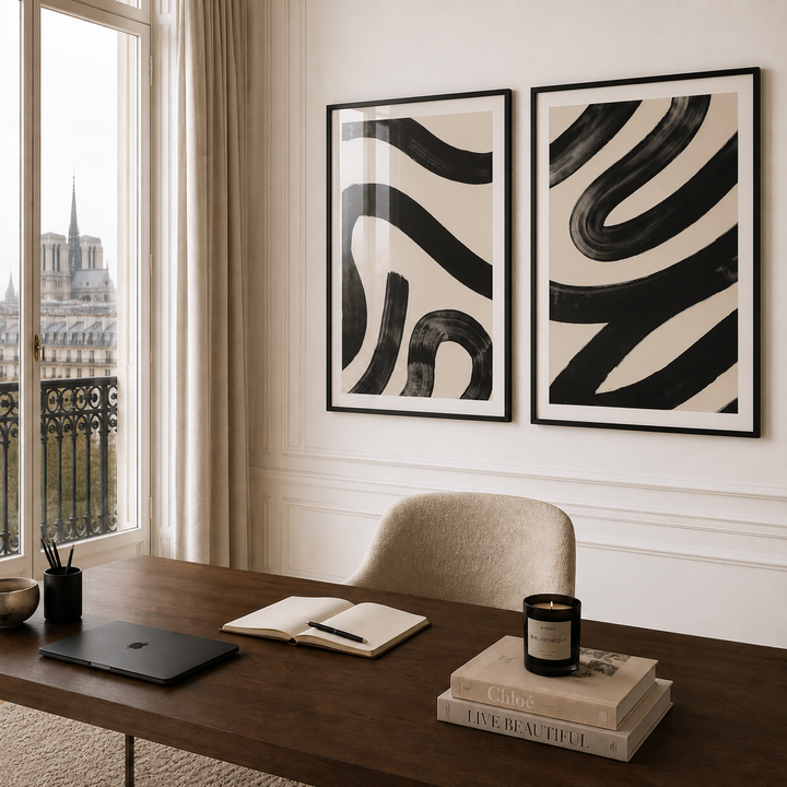 Modern office interior with abstract art on the wall, desk, and window view.