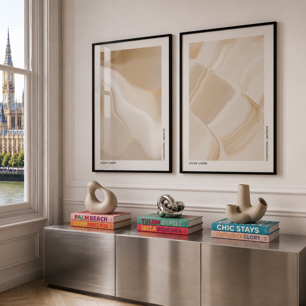 Modern interior with abstract art, books, and sculptures on a metallic console table.