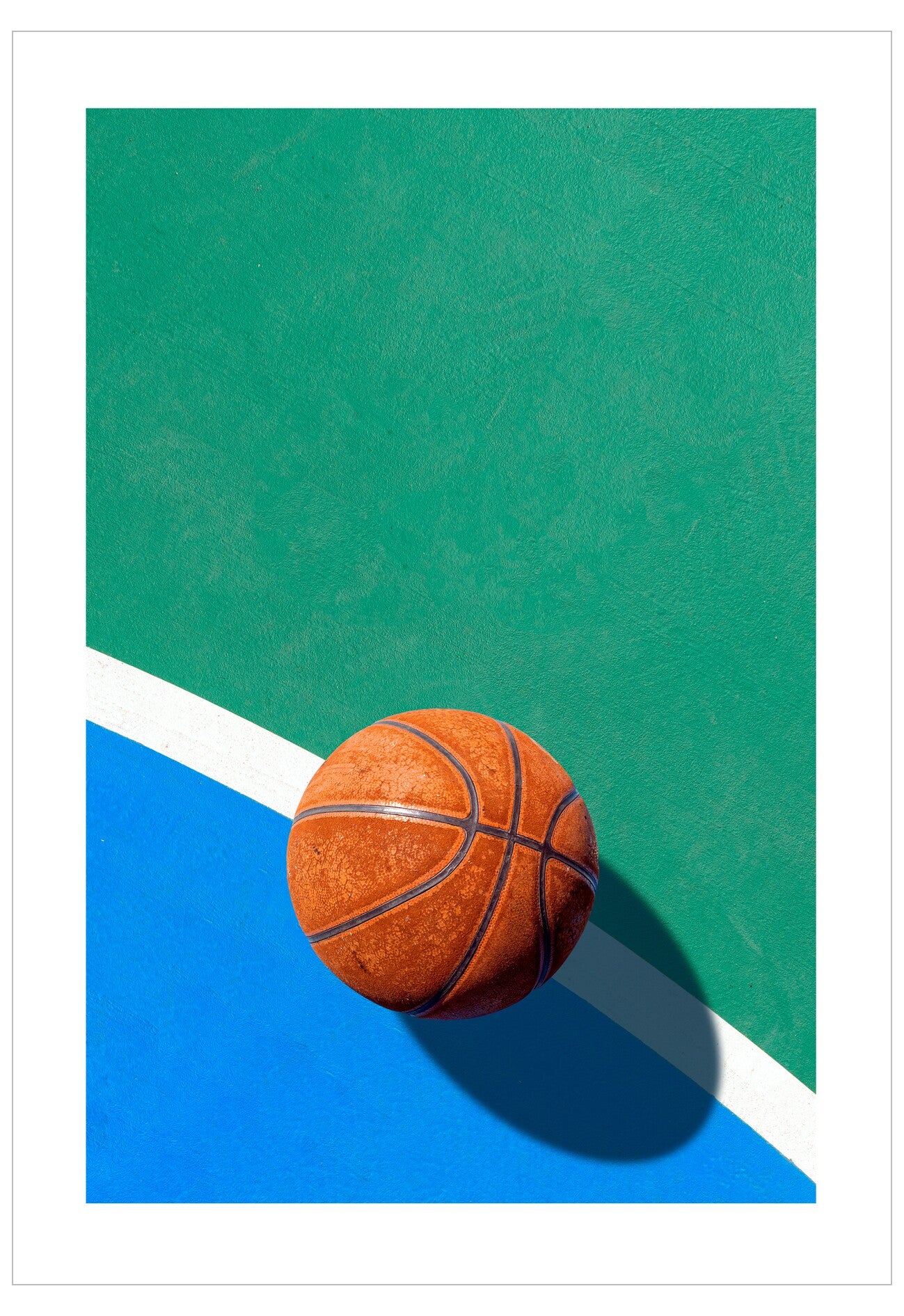 Basketball on a green and blue surface