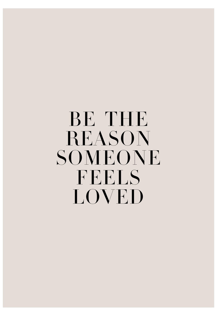 Motivational quote 'Be the reason someone feels loved' on a light pink background