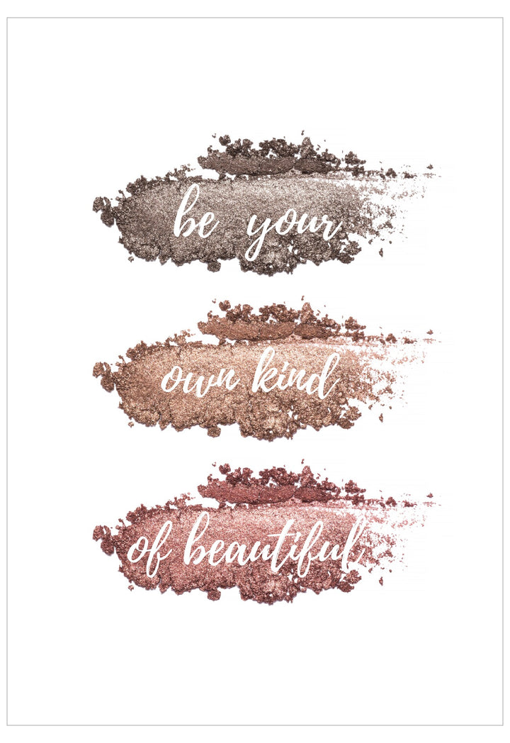 Motivational quote 'be your own kind of beautiful' with glittery text overlay on a white background