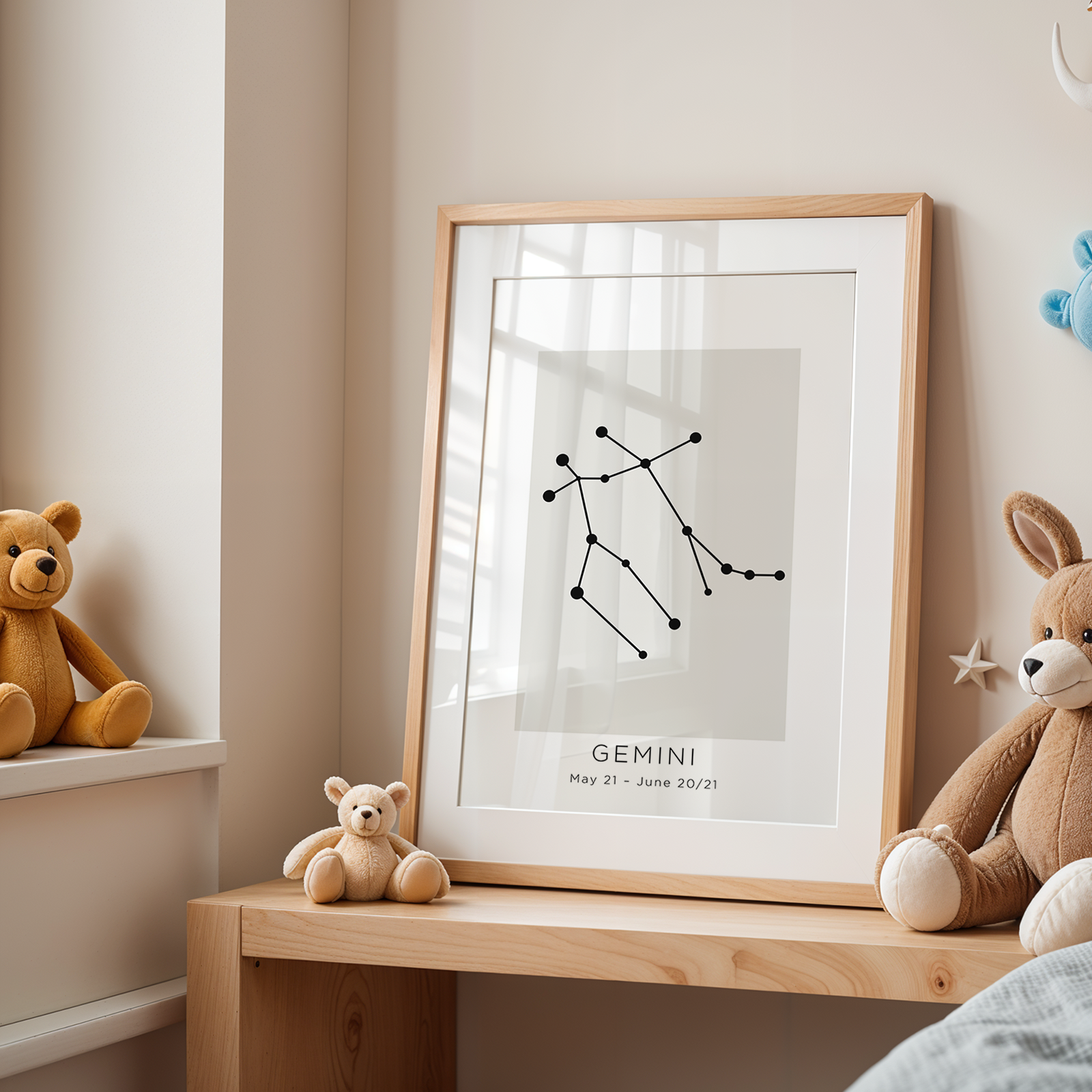 Framed Gemini constellation poster on a wooden shelf with teddy bears in a child's room.