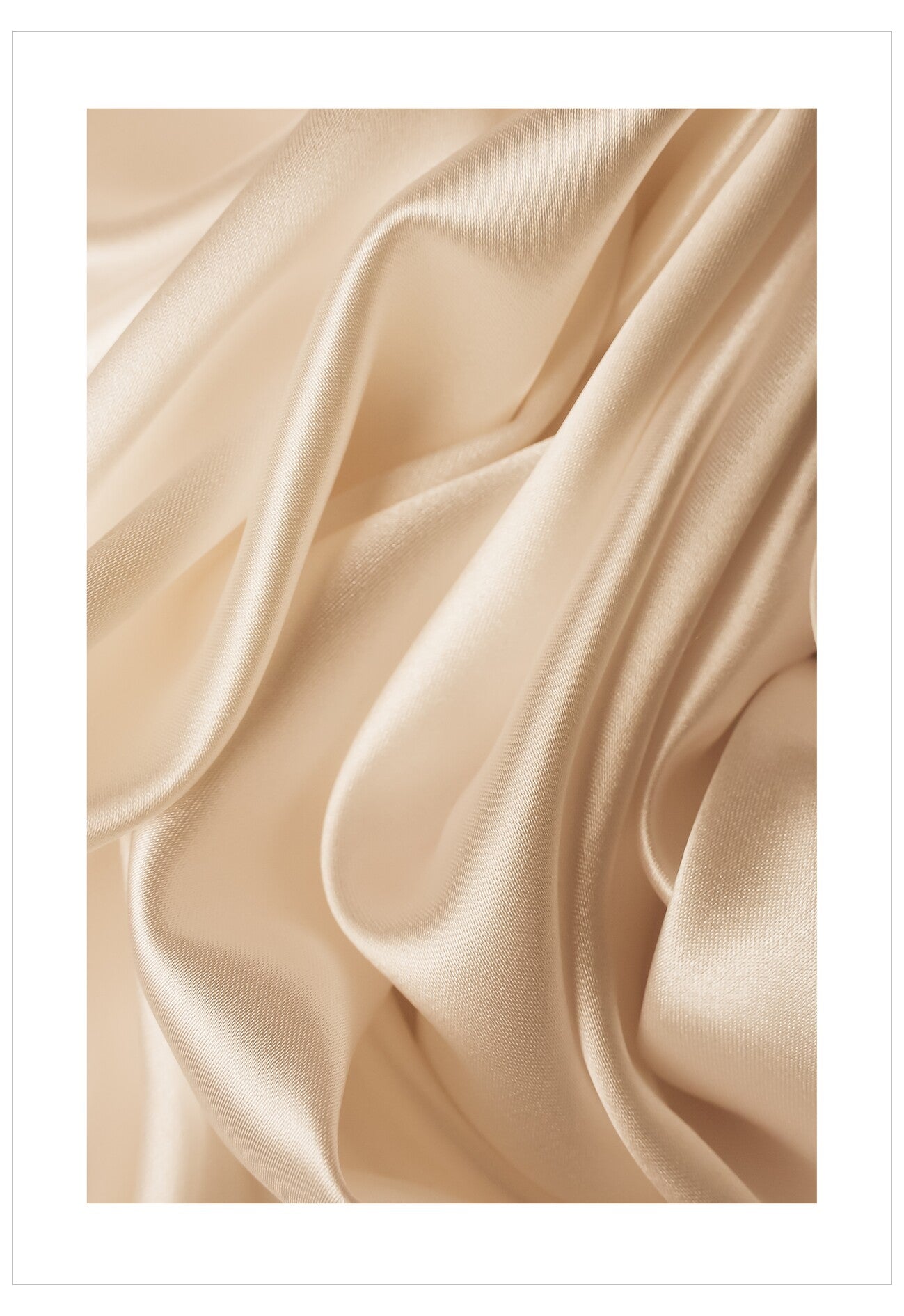 Close-up of beige satin fabric with soft folds