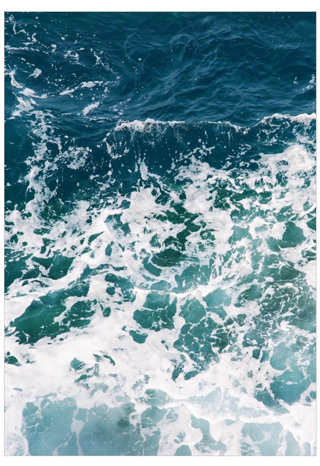 Close-up of turbulent ocean waves with white foam.