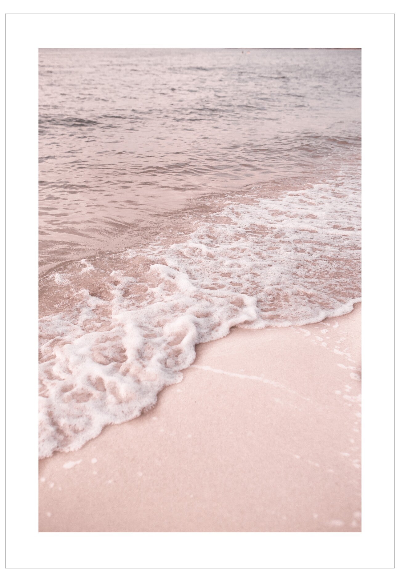 Pink beach with waves crashing onto the shore