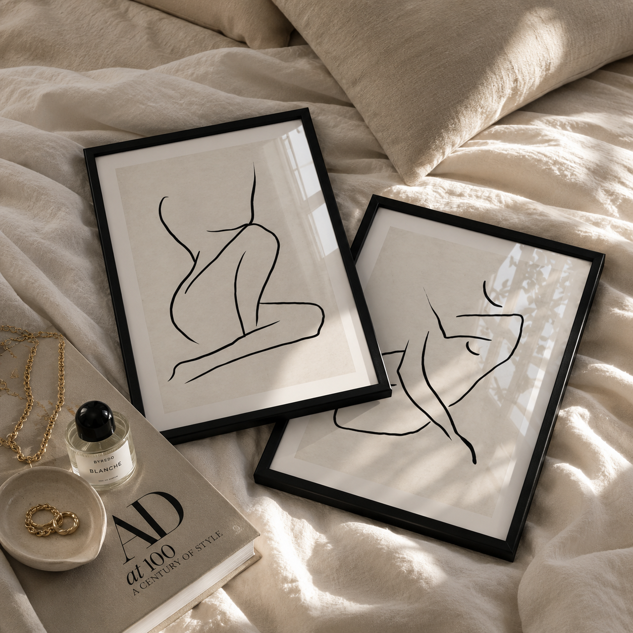 stylish abstract line art in black frames in a luxury bedroom