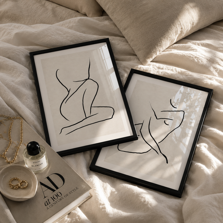 stylish abstract line art in black frames in a luxury bedroom