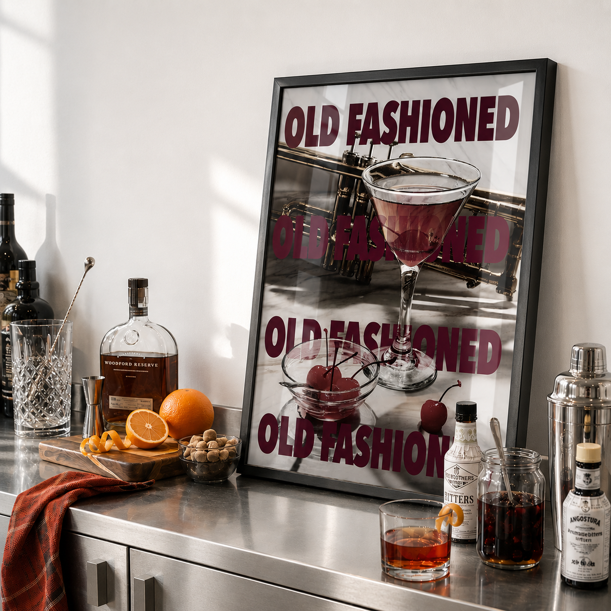 Bar setup with an 'Old Fashioned' themed poster, bottles, and a cocktail on a metallic surface.