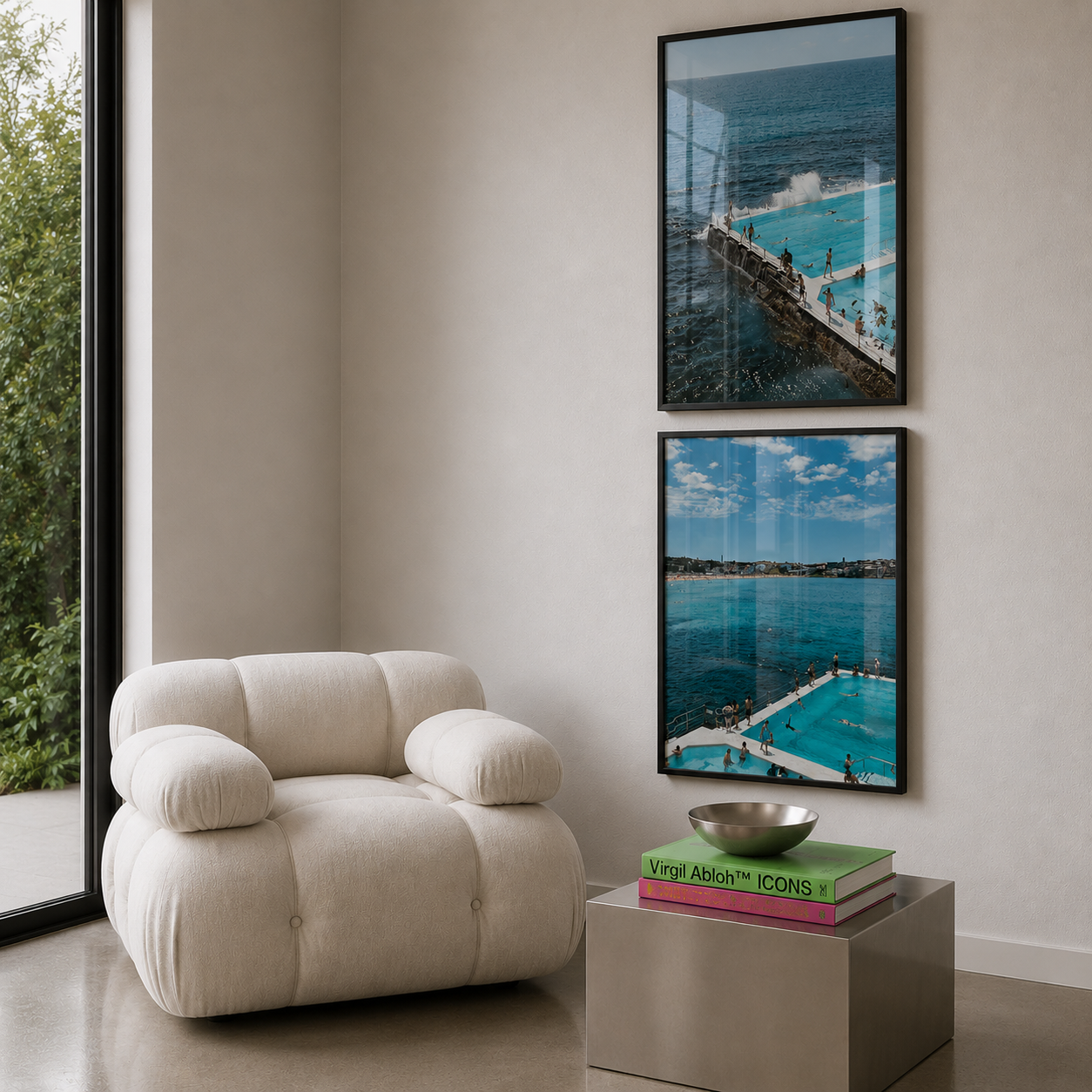 Modern living room with a beige armchair, small table, and framed pictures of bondi beach