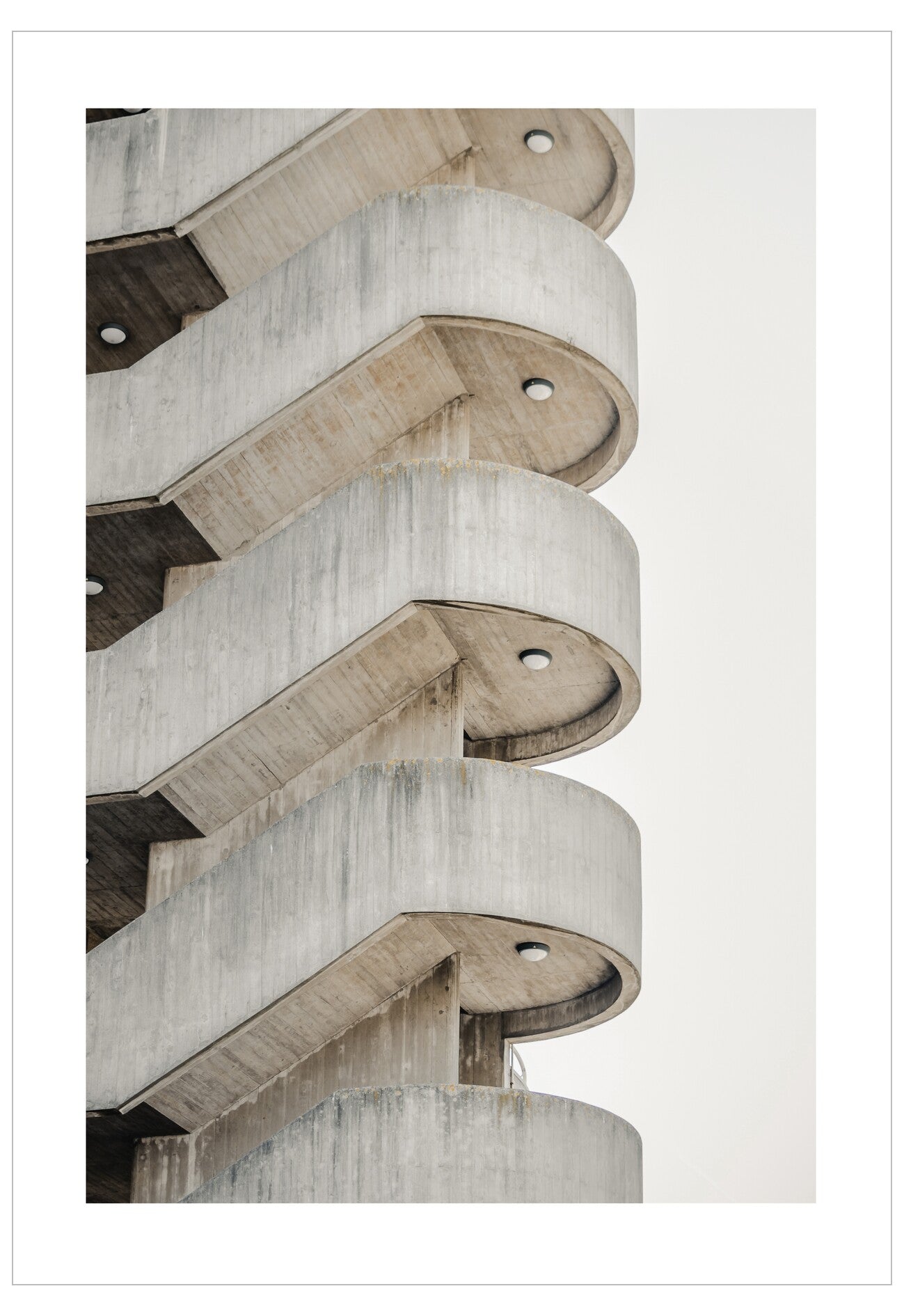 Concrete architectural detail with circular elements on a light gray background