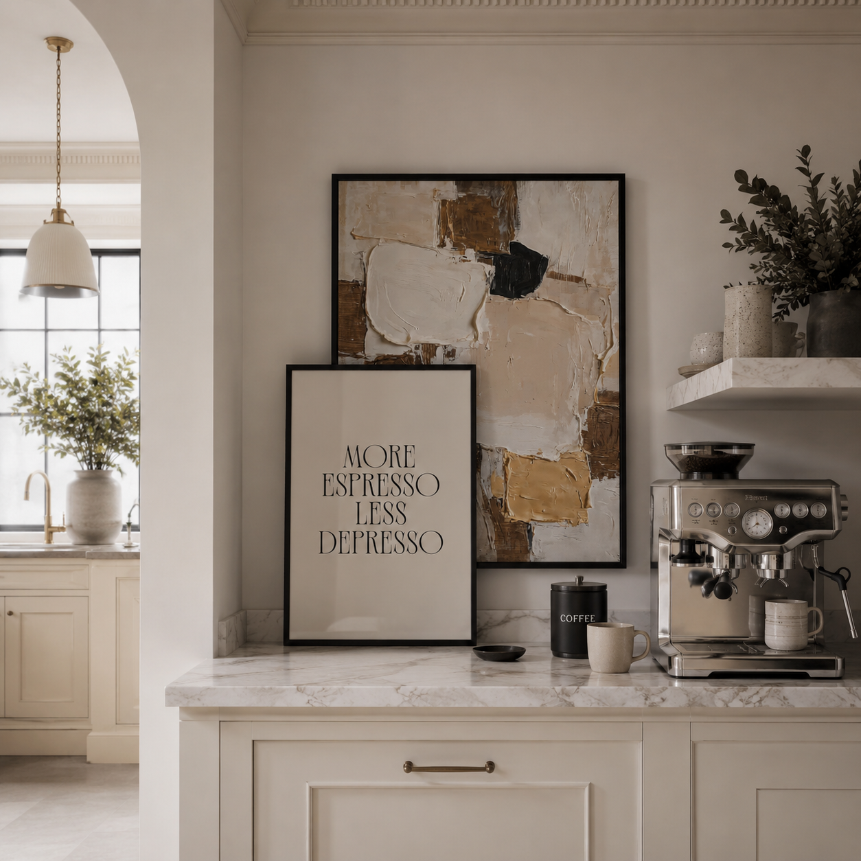 Modern kitchen with coffee machine, framed art, and decor elements.
