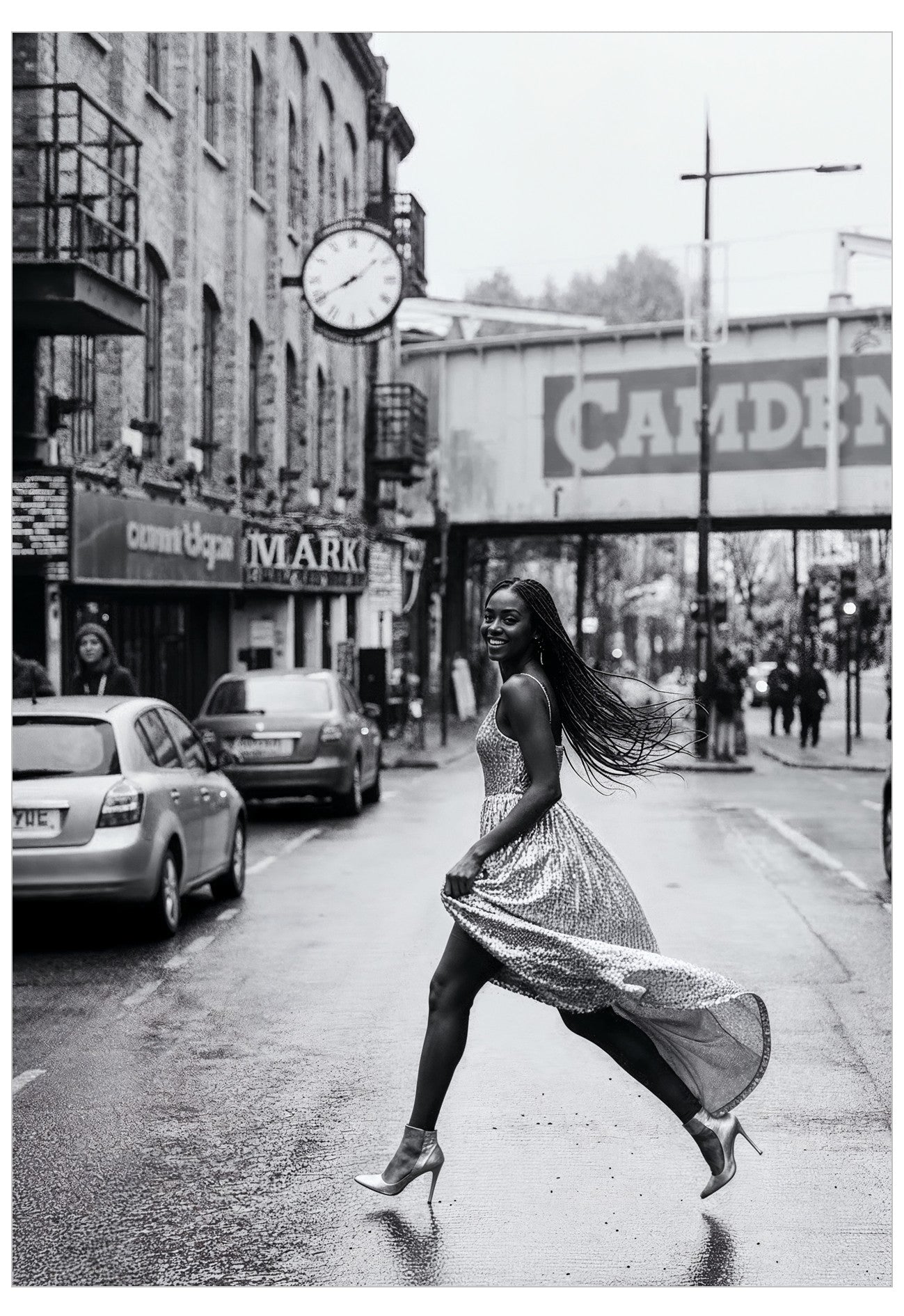 Woman in a dress crossing a street in Camden with a market and clock tower in the background