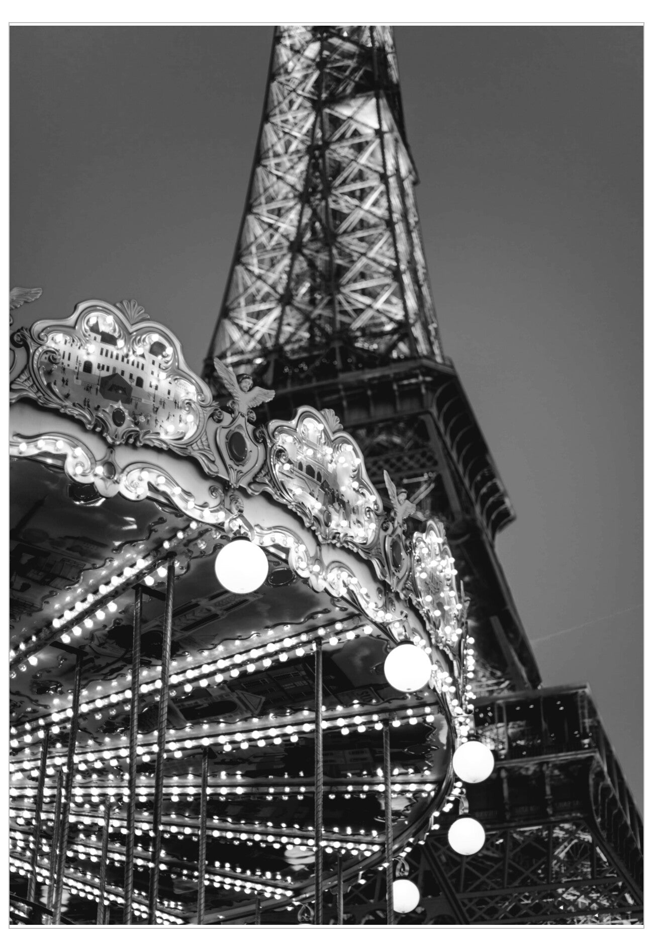 Eiffel Tower with a carousel at night in black and white