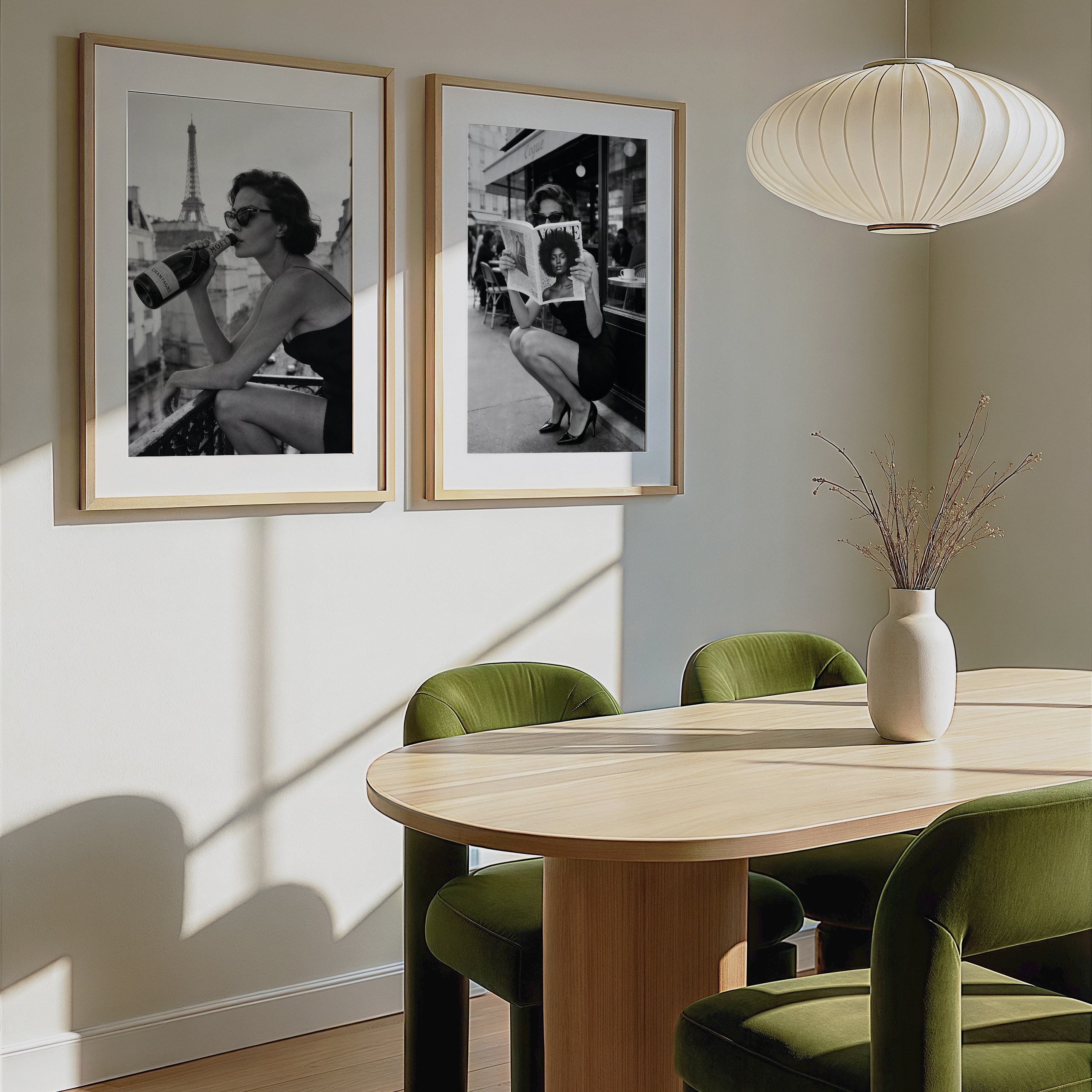 Dining room with wooden table, green chairs, and framed black and white photos on the wall.