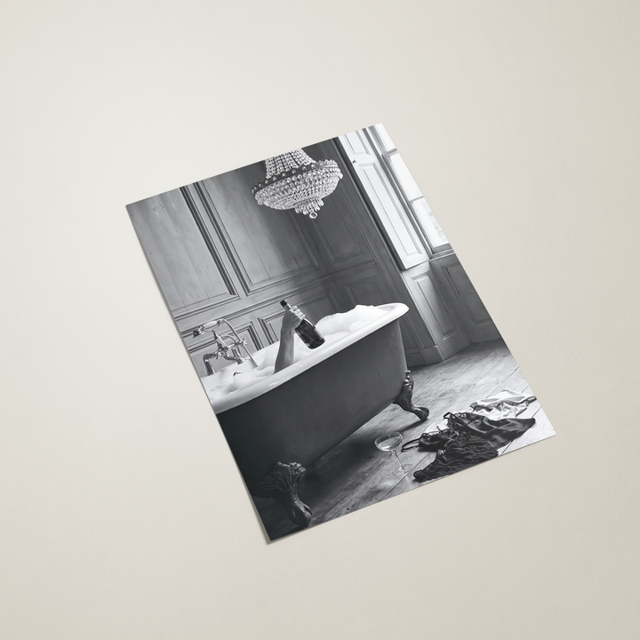 Black and white photo of a bathroom with a freestanding bathtub on a beige background