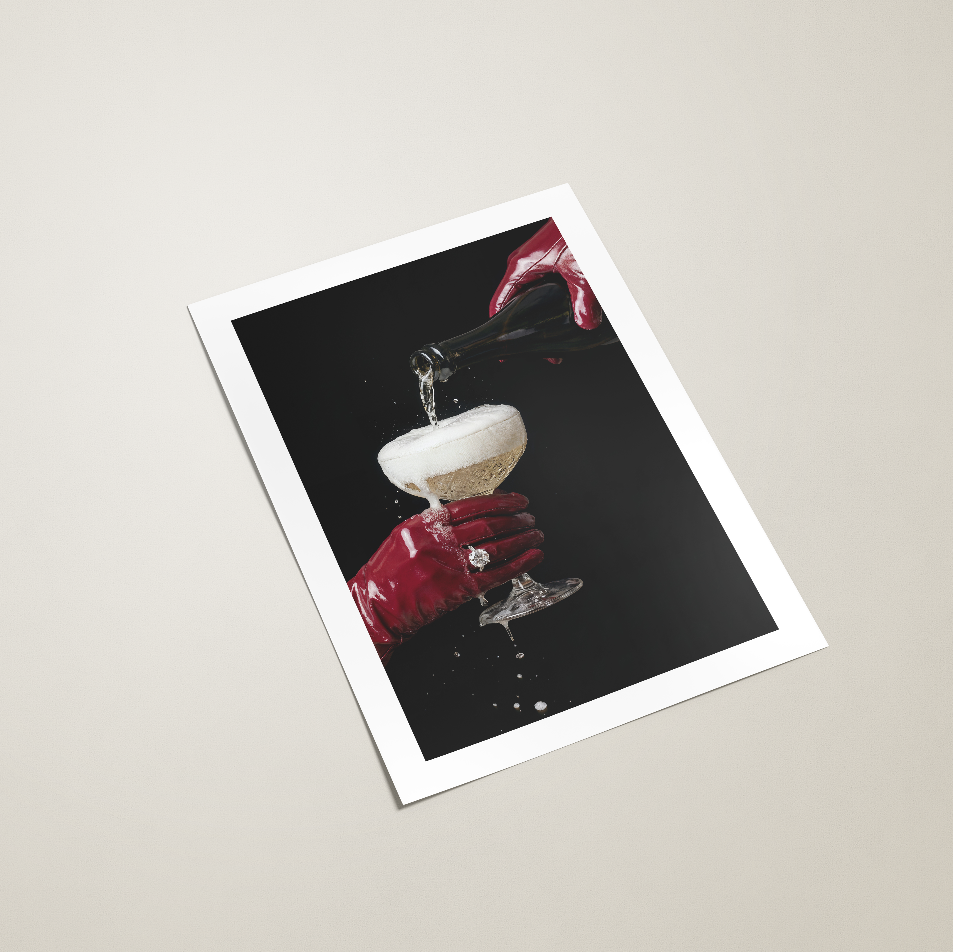 poster with a red hand holding a glass of champagne on a black background