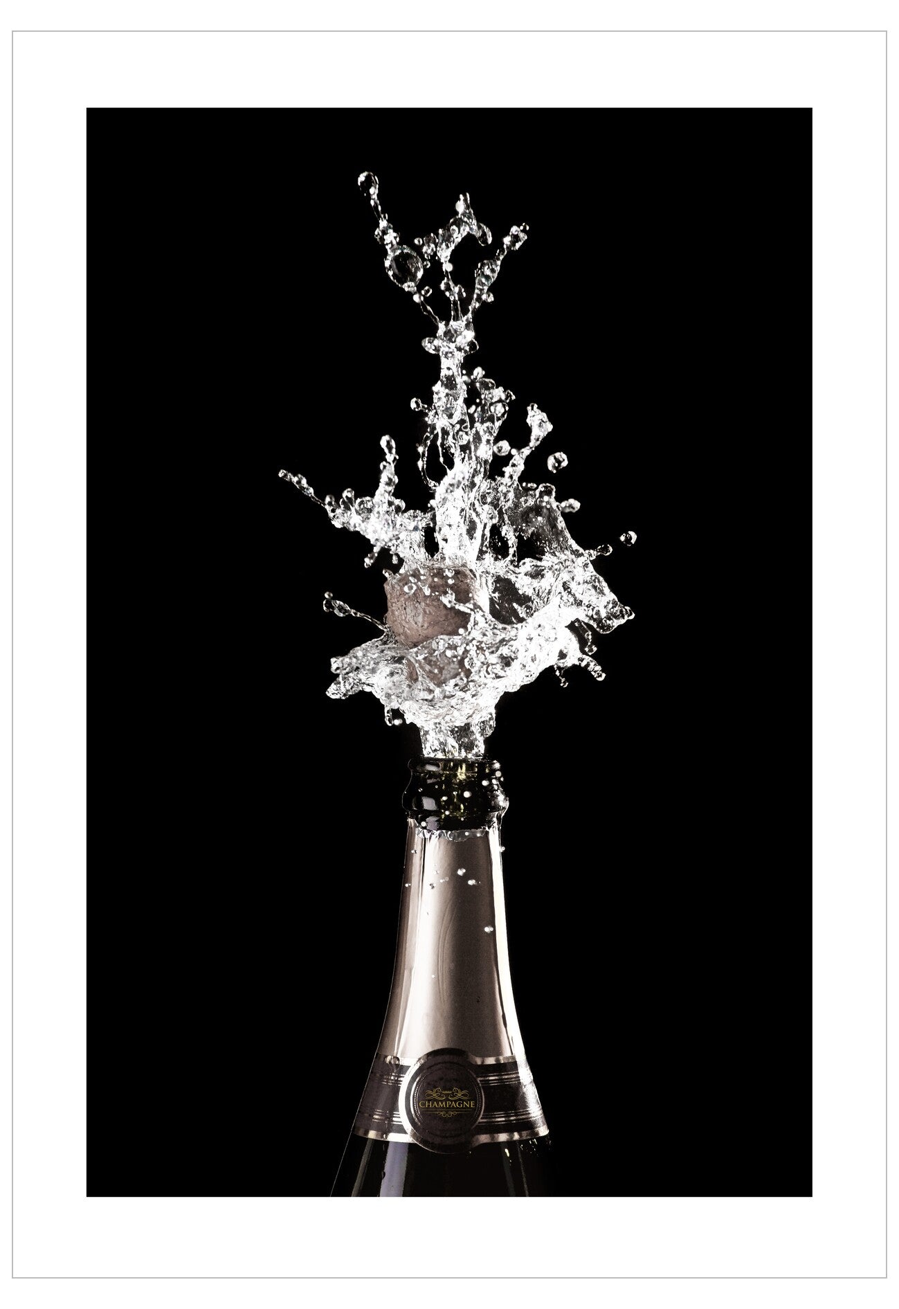 Champagne bottle with a dramatic splash against a black background