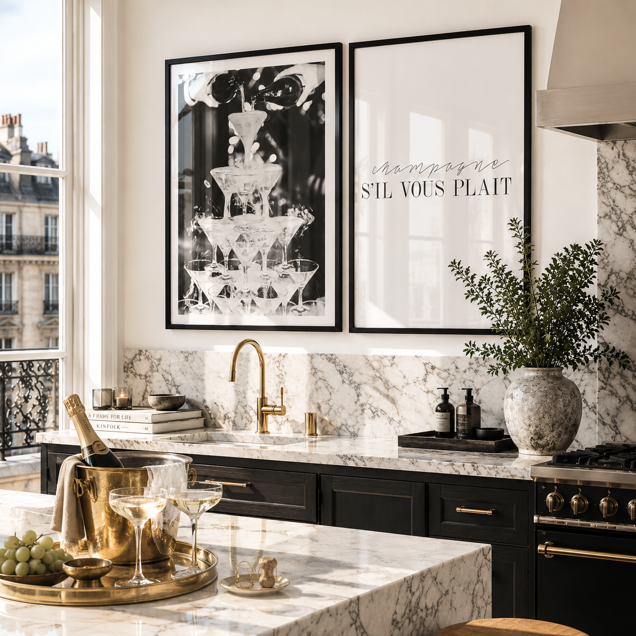 Modern kitchen with marble countertops, gold fixtures, and framed art on the wall.