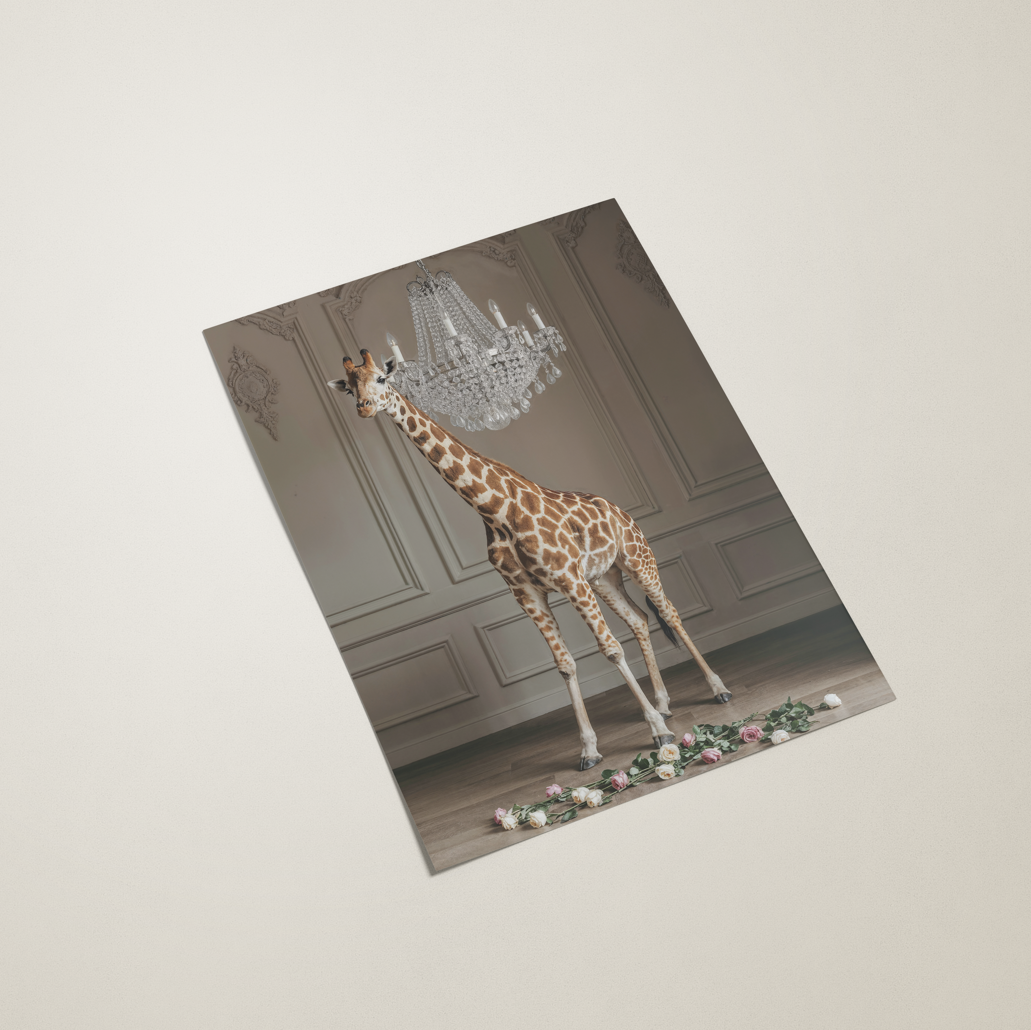 Giraffe standing in a room with a chandelier on a decorative card