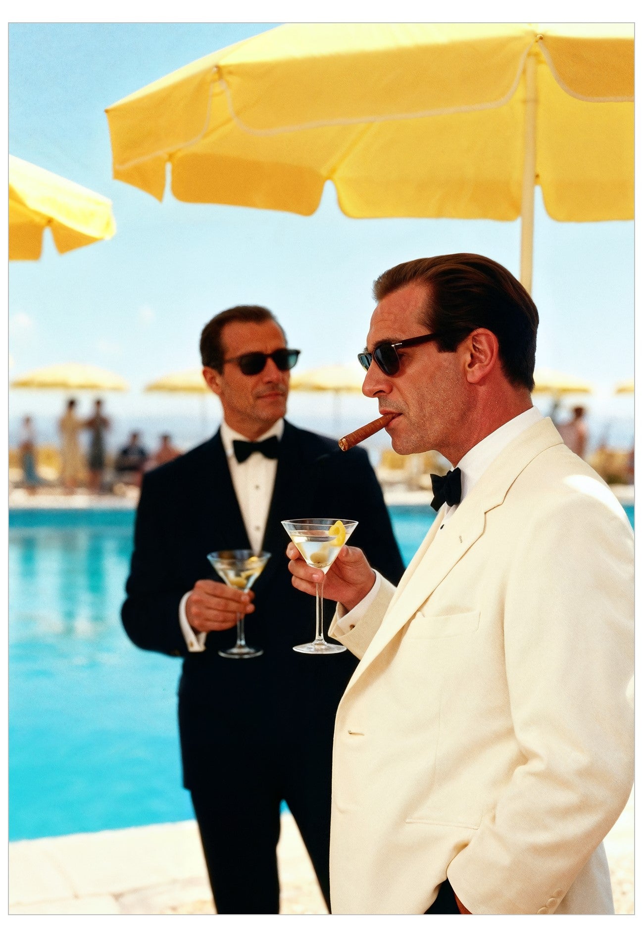 Two men in formal suits by a poolside with yellow umbrellas.