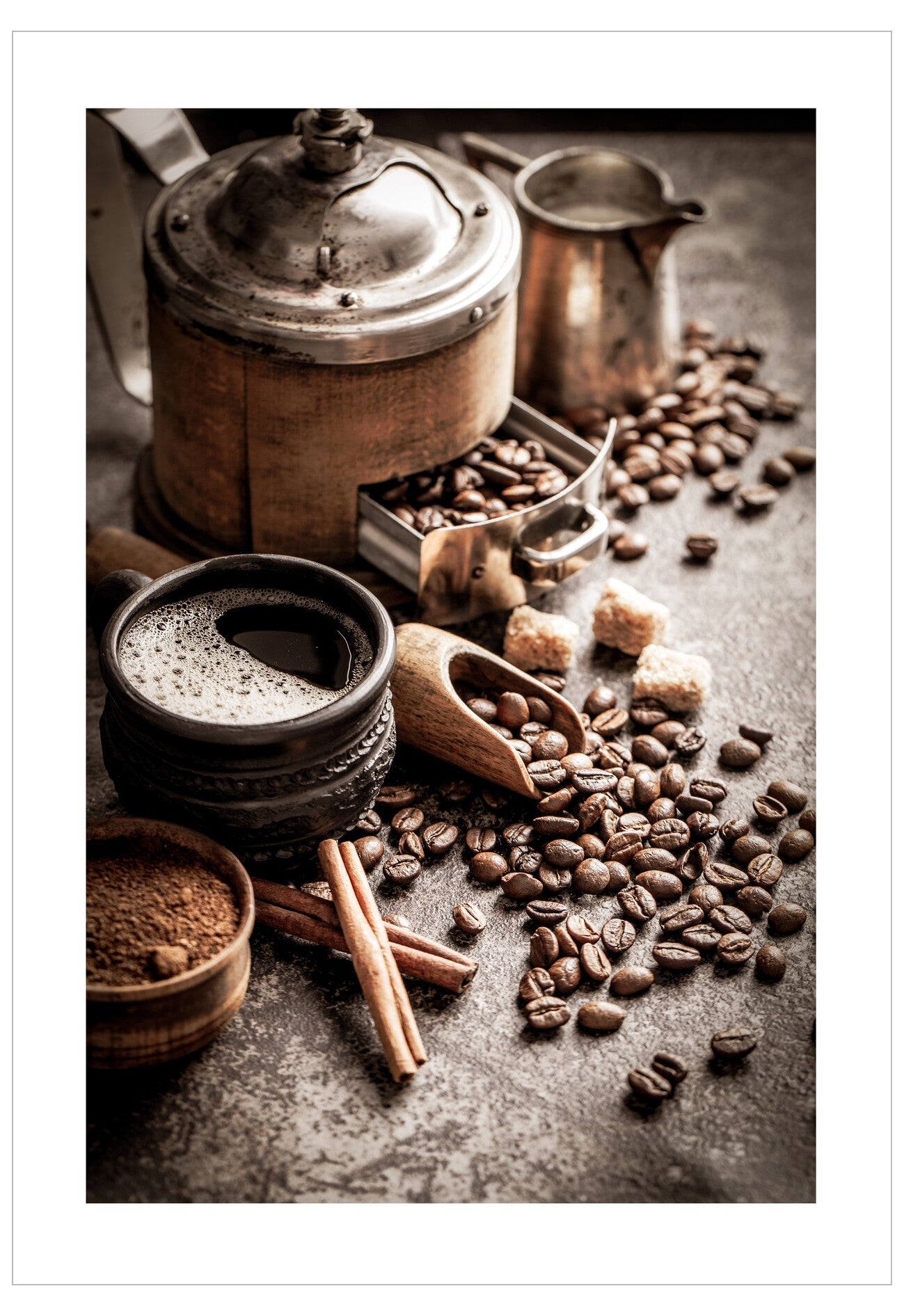 Coffee beans, a pot, and other coffee-making items on a textured surface