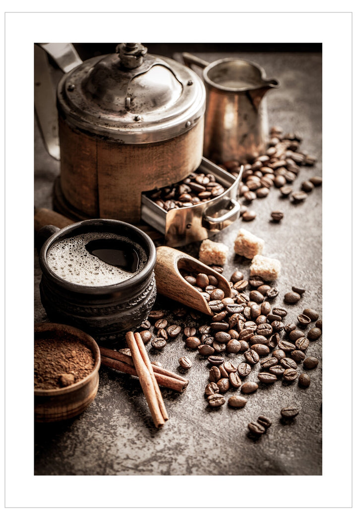 Coffee beans, a pot, and other coffee-making items on a textured surface