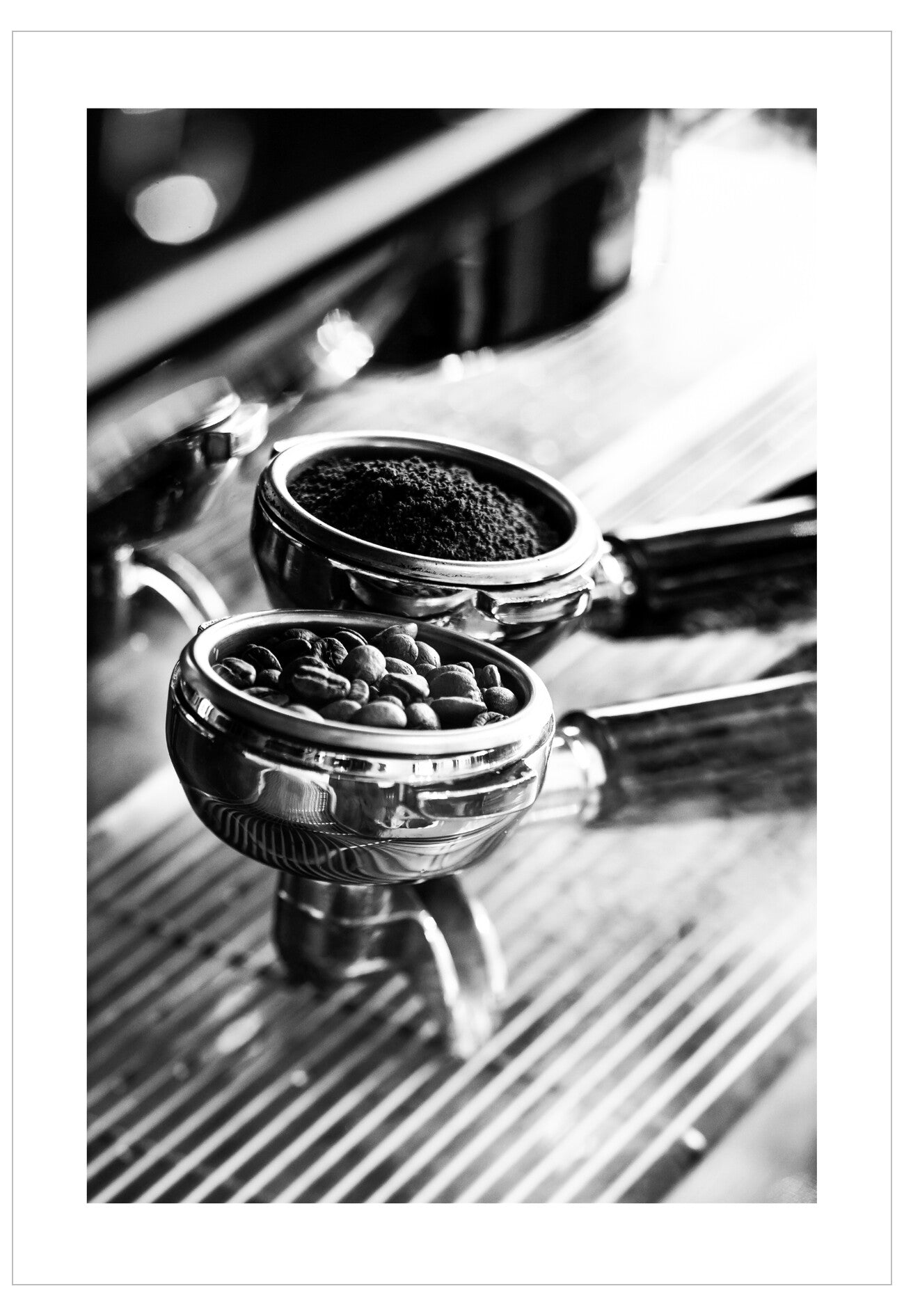 Close-up of a coffee grinder with coffee beans and grounds.