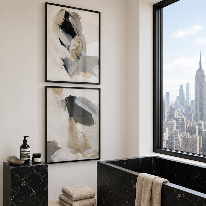 Bathroom with abstract art on the wall and a cityscape view from a window.