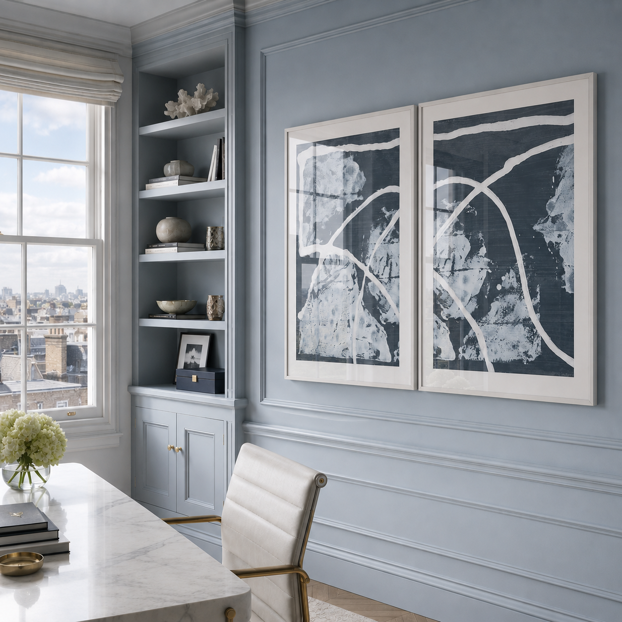 Modern office with gray walls, a desk, and abstract art.
