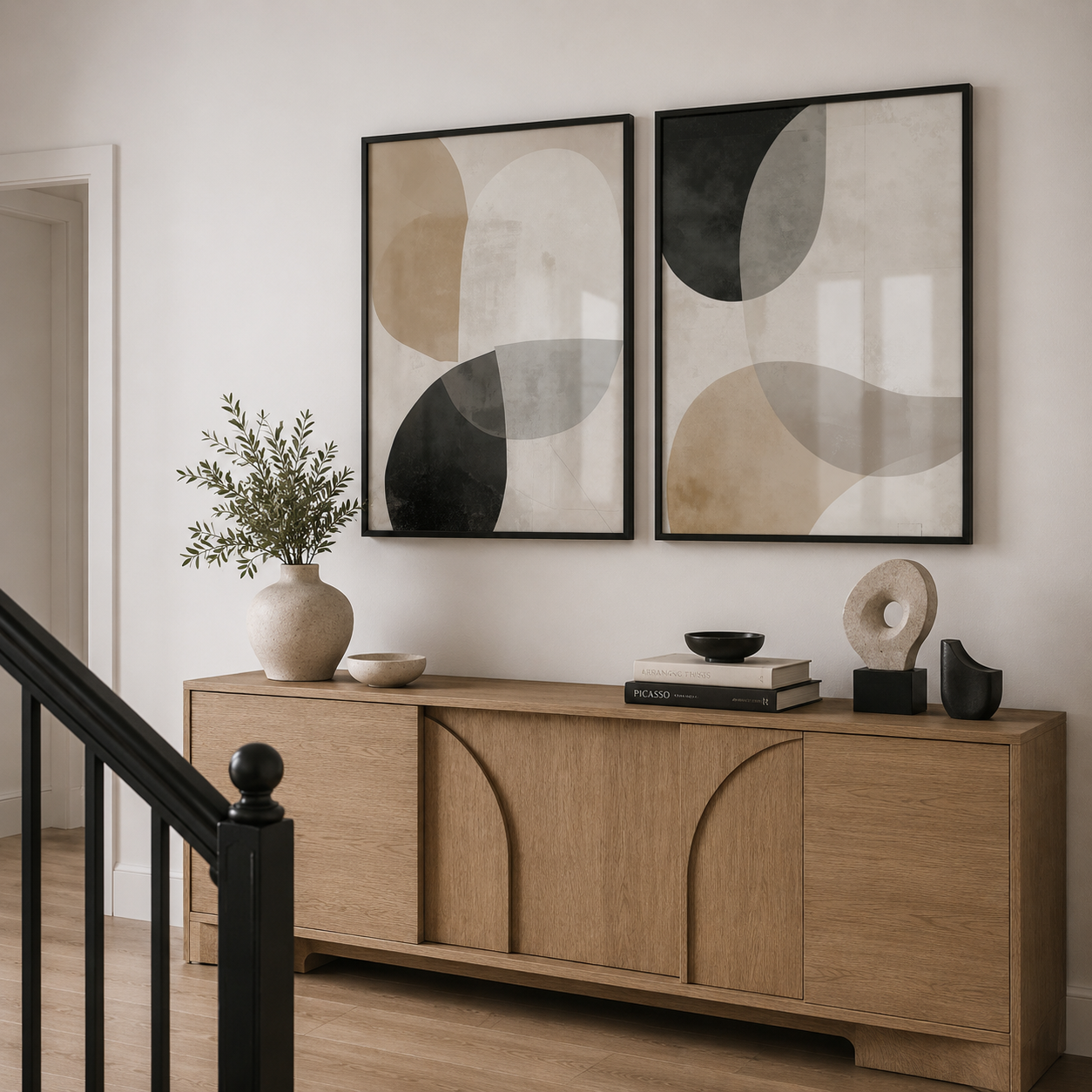 Wooden sideboard with decorative items and abstract wall art in a room.