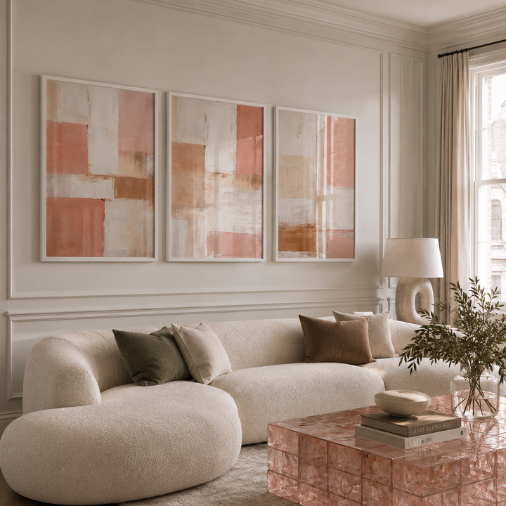Modern living room with a beige sofa, abstract art, and decorative elements.