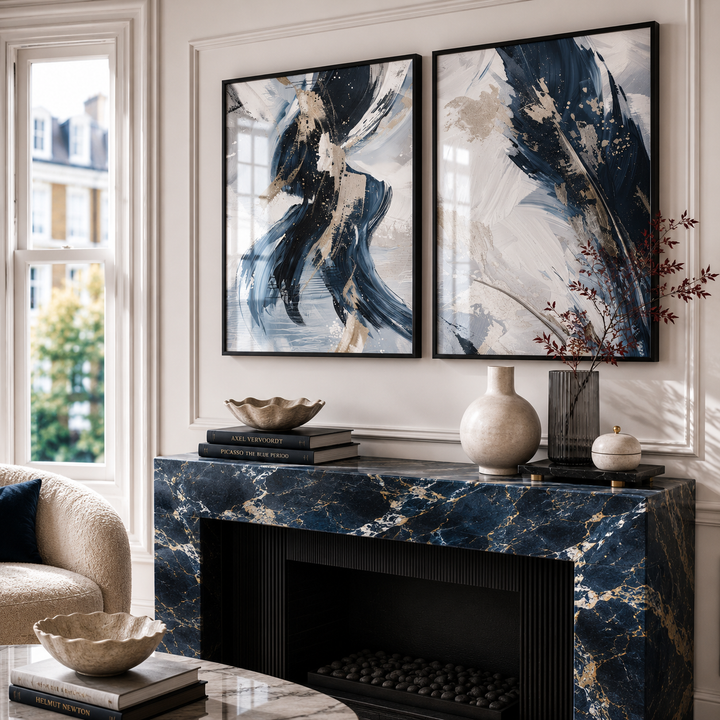 Decorative mantelpiece with abstract art, books, and vases in a luxury blue living room setting.