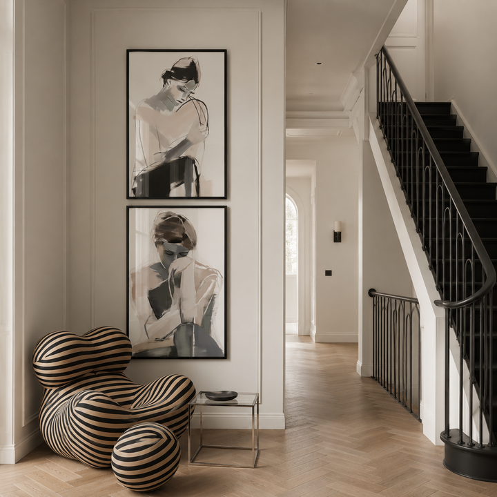 Modern interior with abstract art on the wall and a striped chair.