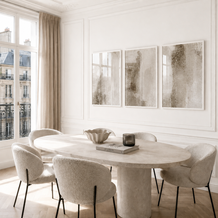 Modern dining room with marble table and chairs in a bright room.