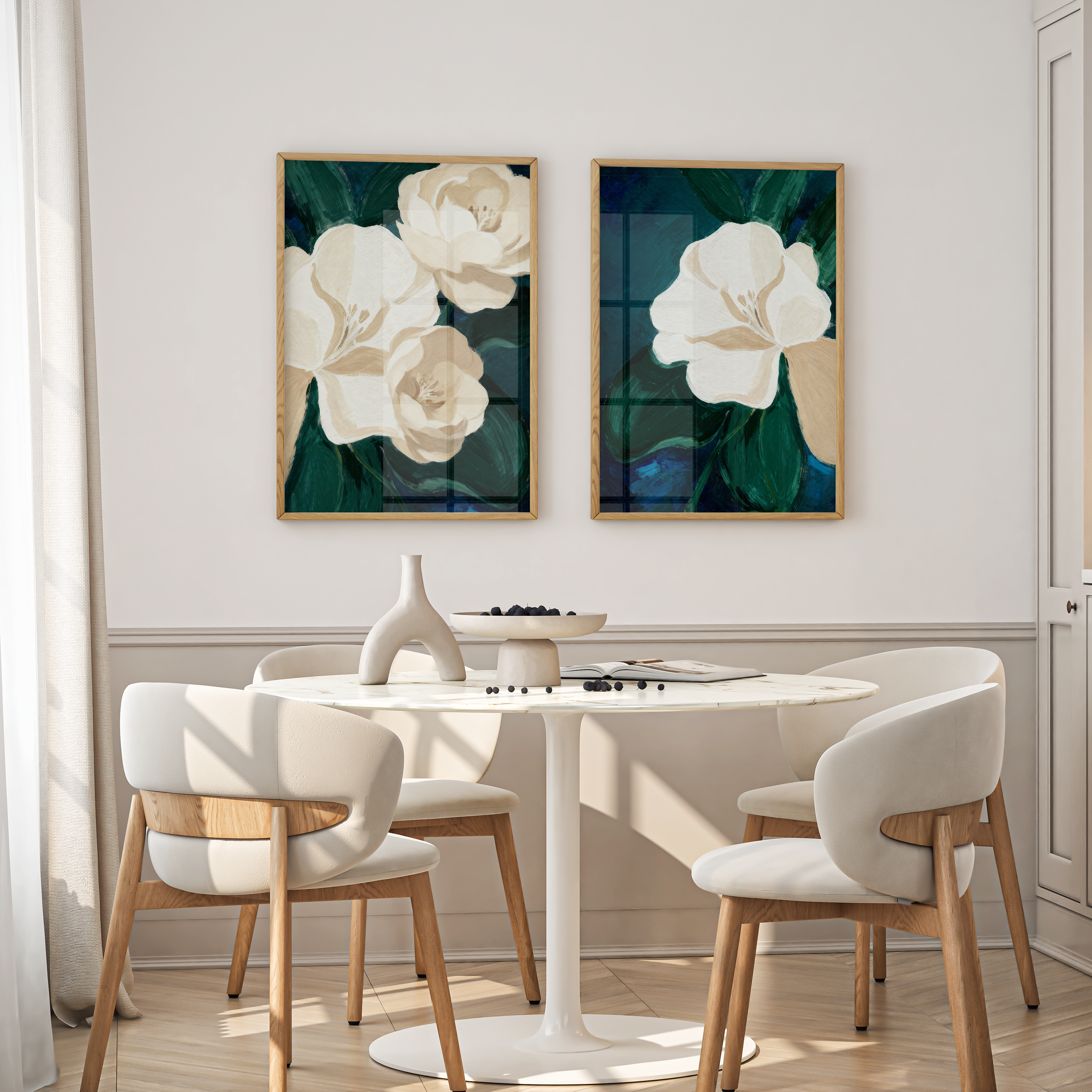 Dining area with a round table and chairs, featuring floral artwork on the wall.