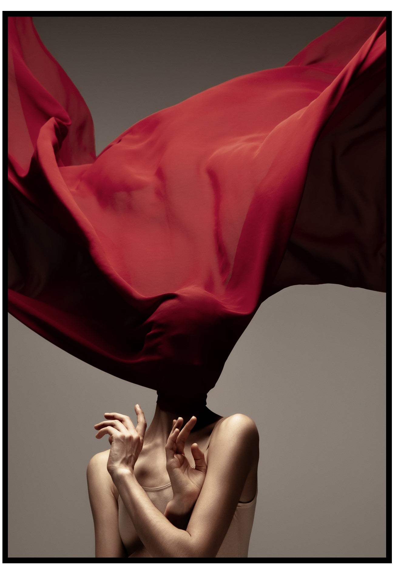 Person with a flowing red fabric over their head against a neutral background