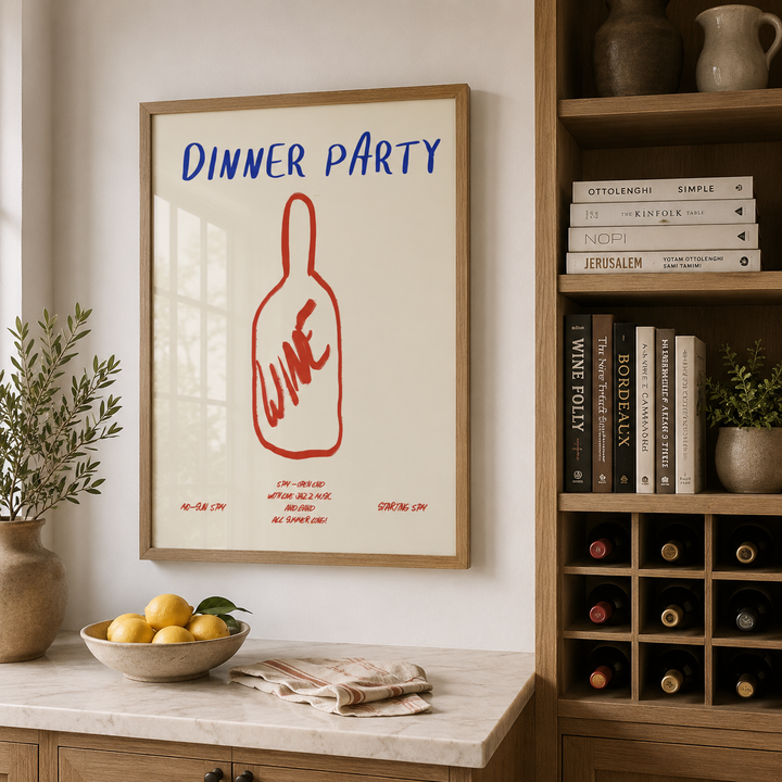 Framed poster with 'Dinner Party' text and wine bottle graphic in a kitchen setting.
