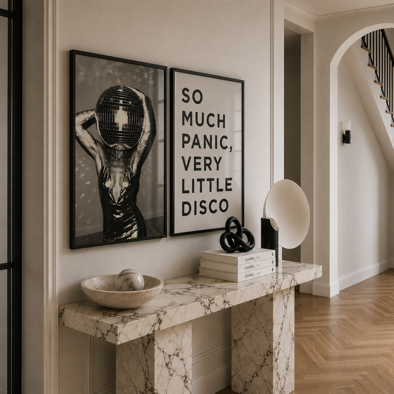 Marble console table with decorative items and framed art in a home setting