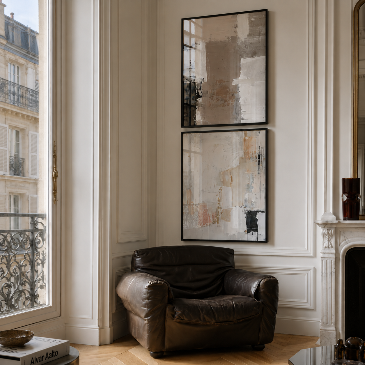 Living room with a leather armchair, abstract art on the wall, and large window.