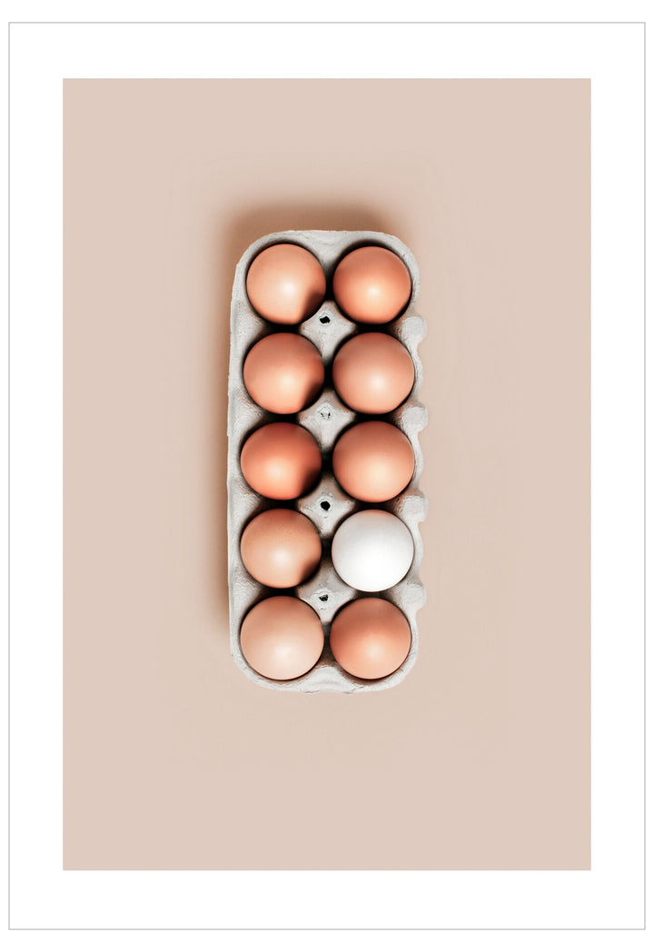 Carton of eggs on a beige background