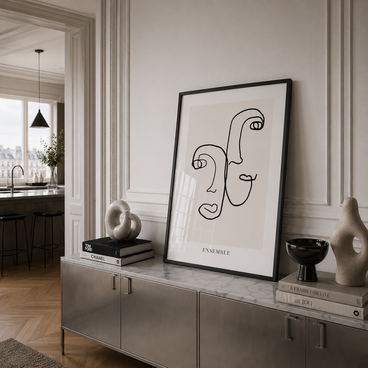 Modern interior with a framed abstract art piece on a sideboard.
