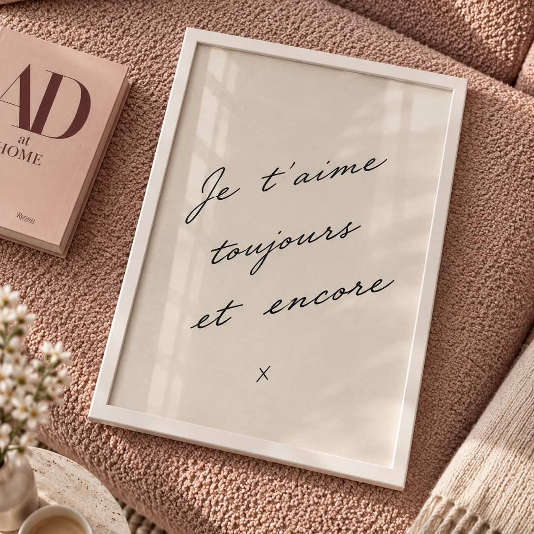 Et Encore Poster featuring the handwritten French phrase “Je t’aime toujours et encore” in elegant black script on a softly textured warm ivory background.