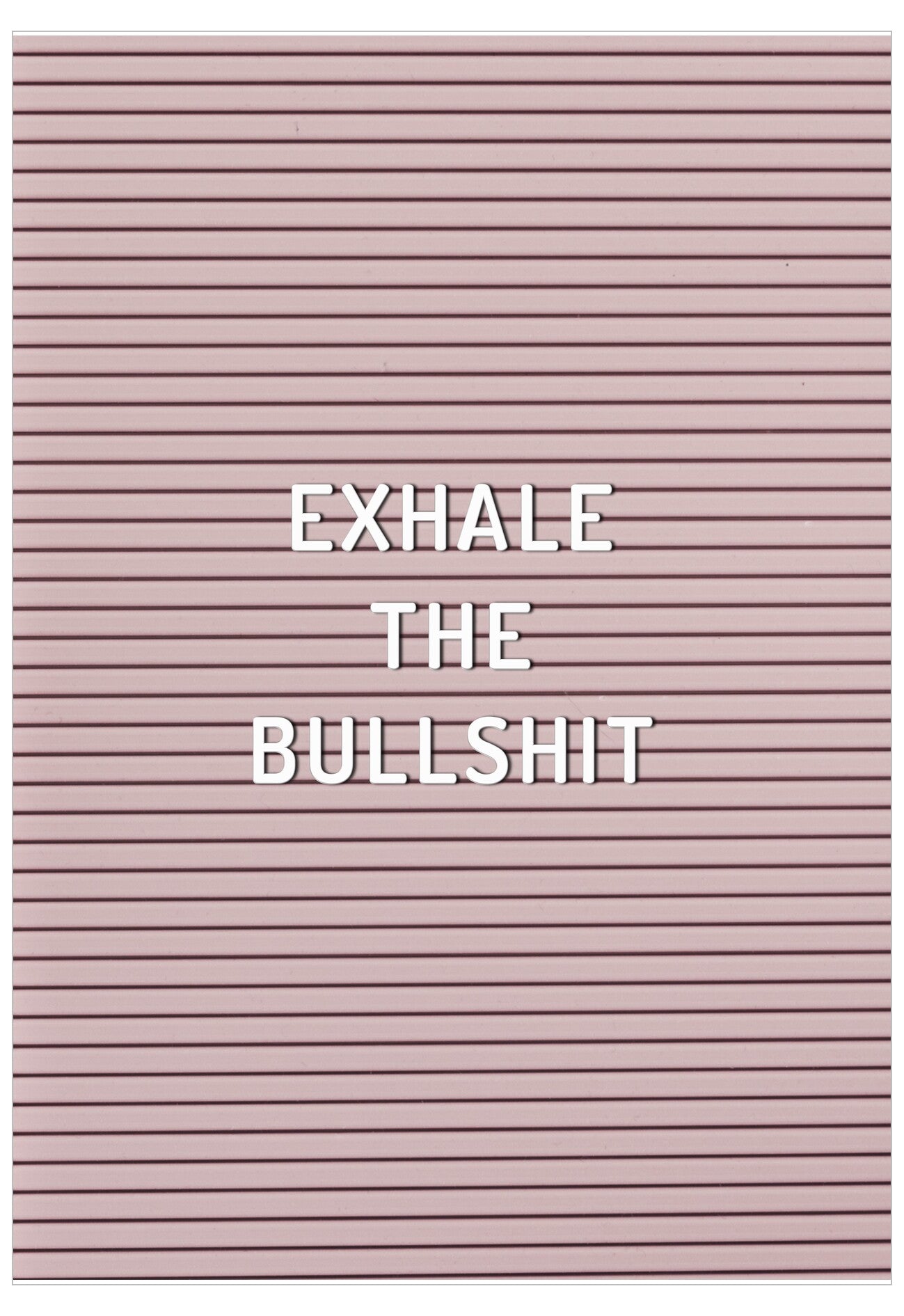 Pink letter board with 'EXHALE THE BULLSHIT' text
