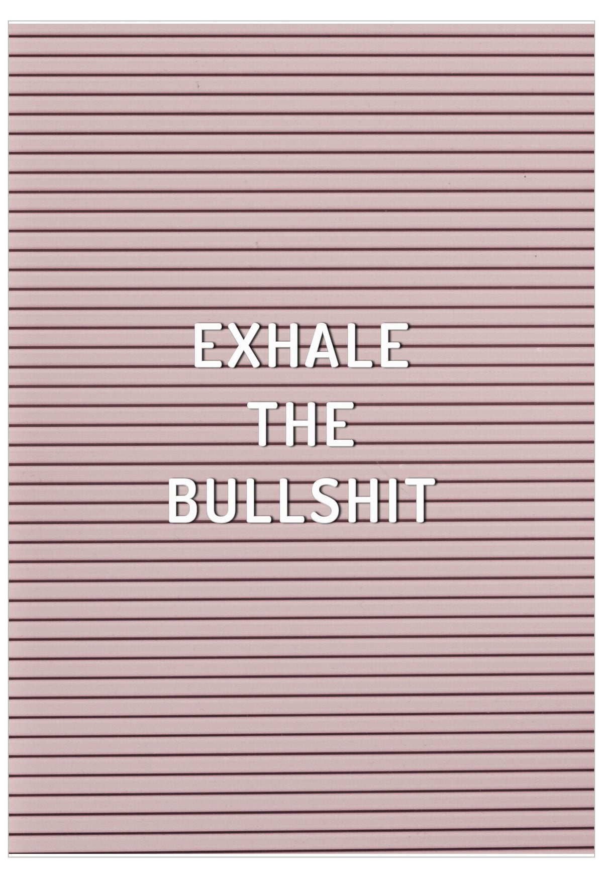 Pink letter board with 'EXHALE THE BULLSHIT' text