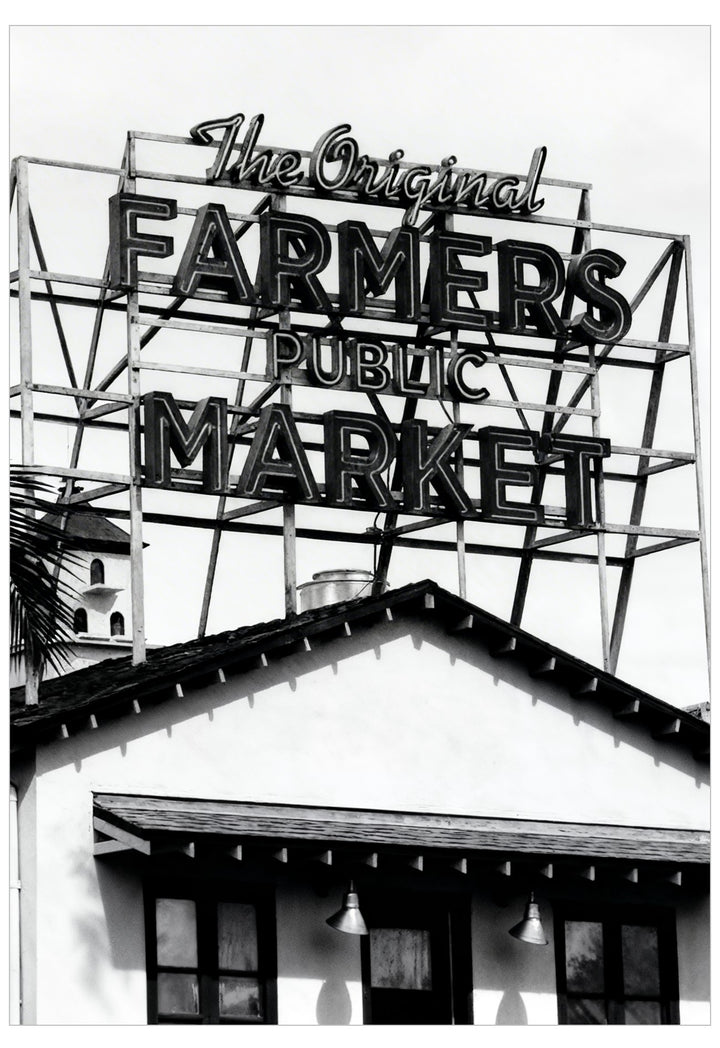 Black and white image of a sign for 'The Original Farmers Public Market'.