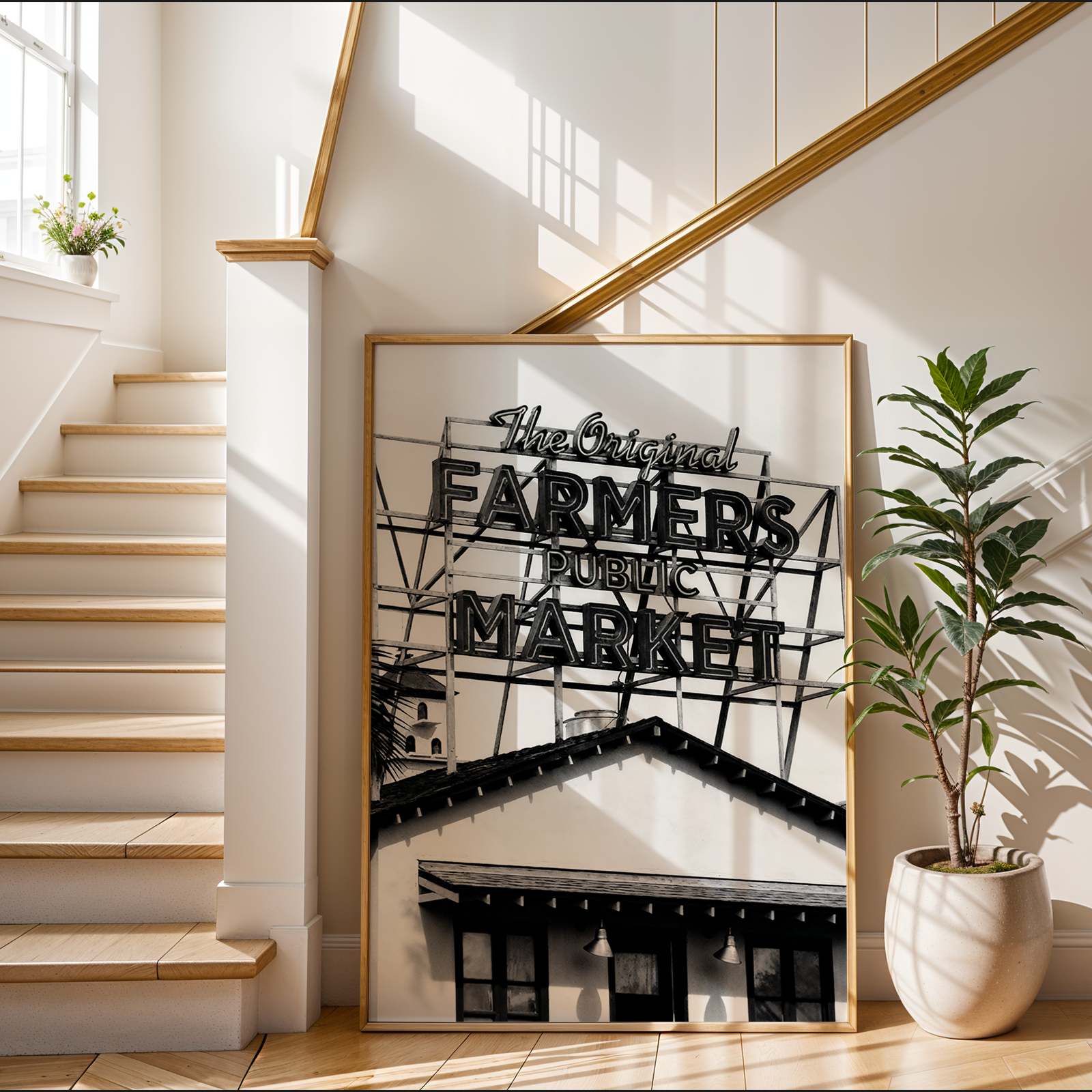 Framed artwork of a farmers market sign on a wall next to a staircase