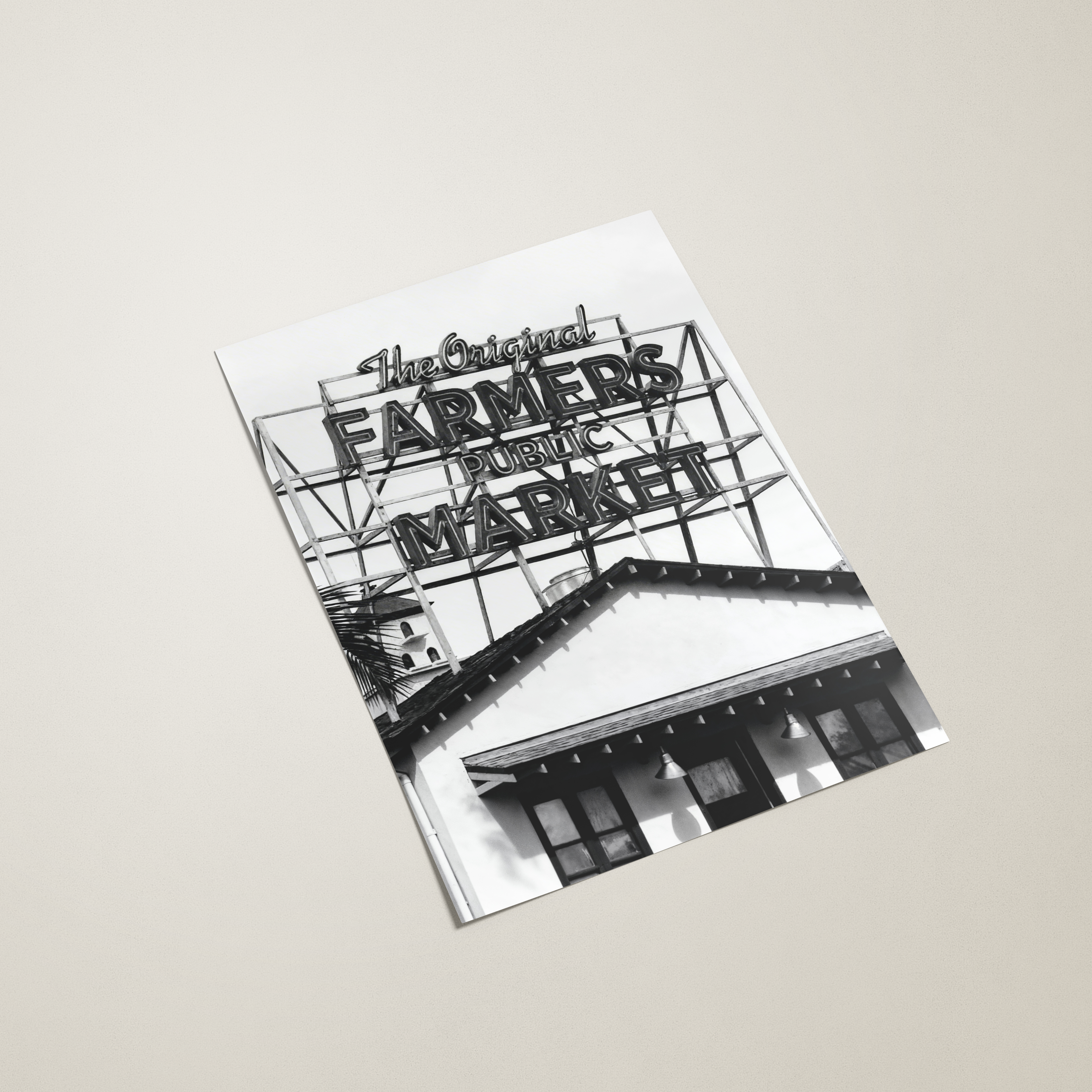 Book or magazine with black and white design on a beige background