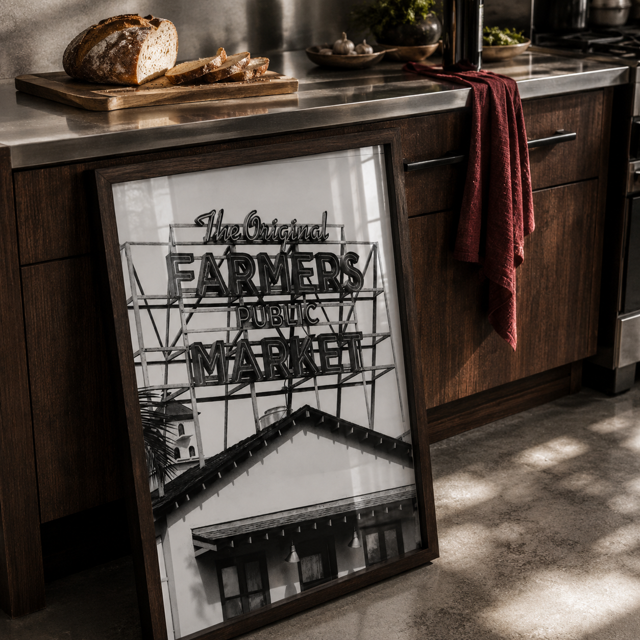Framed sign for 'The Original Farmers Public Market' on a kitchen counter with bread and fries.