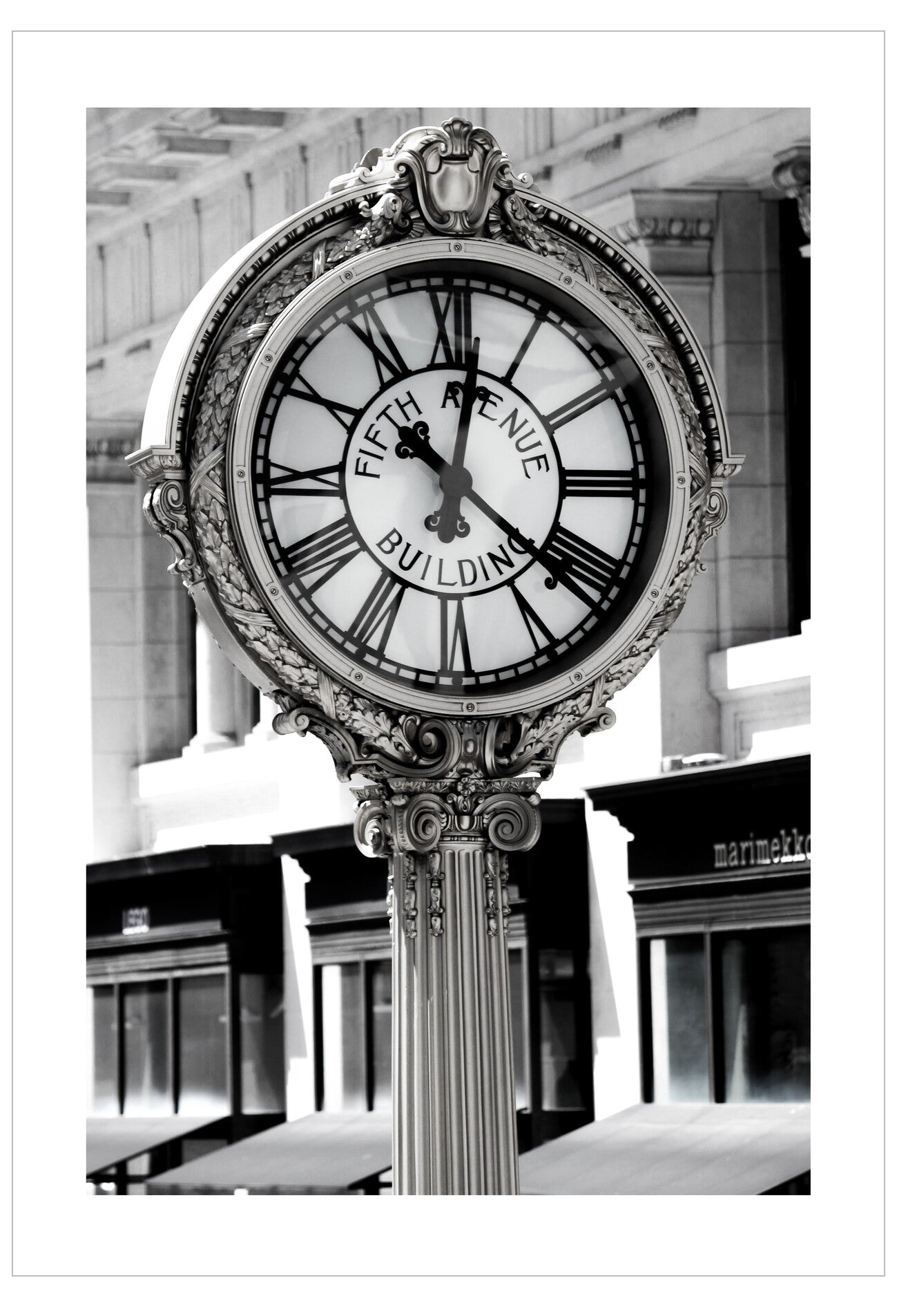 Decorative clock with 'Fifth Avenue Building' inscription in an indoor setting