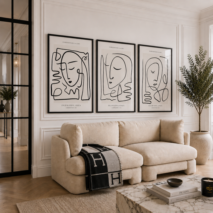 Modern living room with a beige sofa, abstract wall art, and decorative elements.